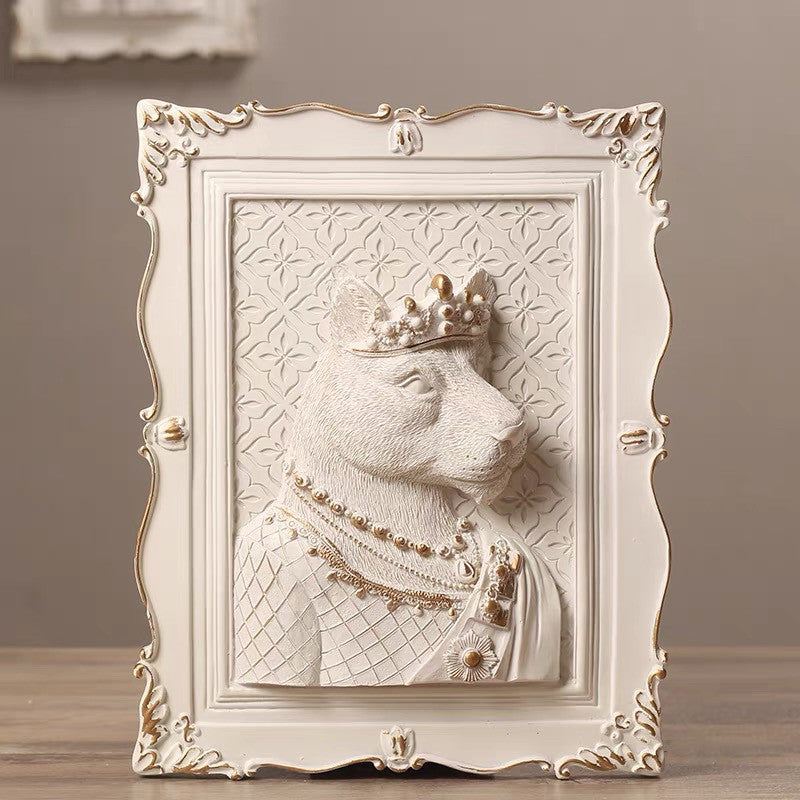Decorative wall art of a crowned bear with intricate details in a ornate frame.