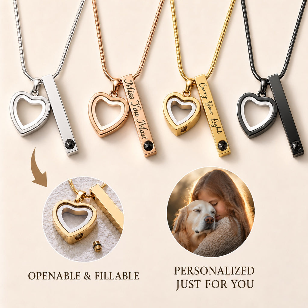 Four titanium steel projection urn necklaces in silver, gold, rose gold, and black finishes displayed side-by-side, showcasing their openable heart keepsake compartments, engraved bars, and a custom photo projection feature.