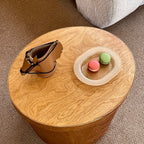 Luxury equestrian-inspired leather horse pen holder displayed on a wooden side table next to a plate of macarons.