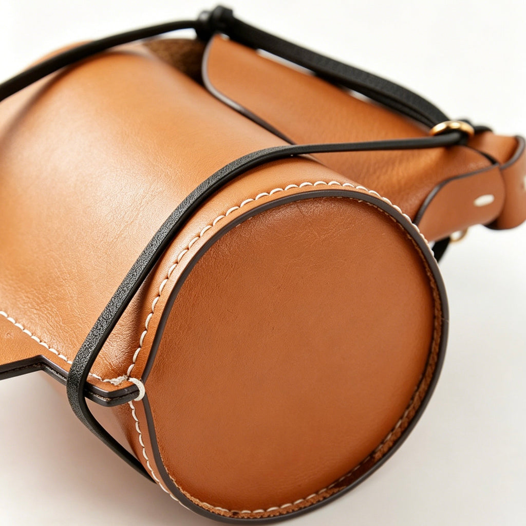 Close-up of the interior of the leather horse desk organizer designed for pens and makeup brushes.