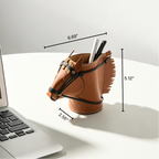 Equestrian leather pen holder showing the detailed stitching and upright storage compartment for office tools.