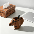 Hand-stitched brown leather horse desk organizer with decorative tassels and sculptural horse head silhouette.