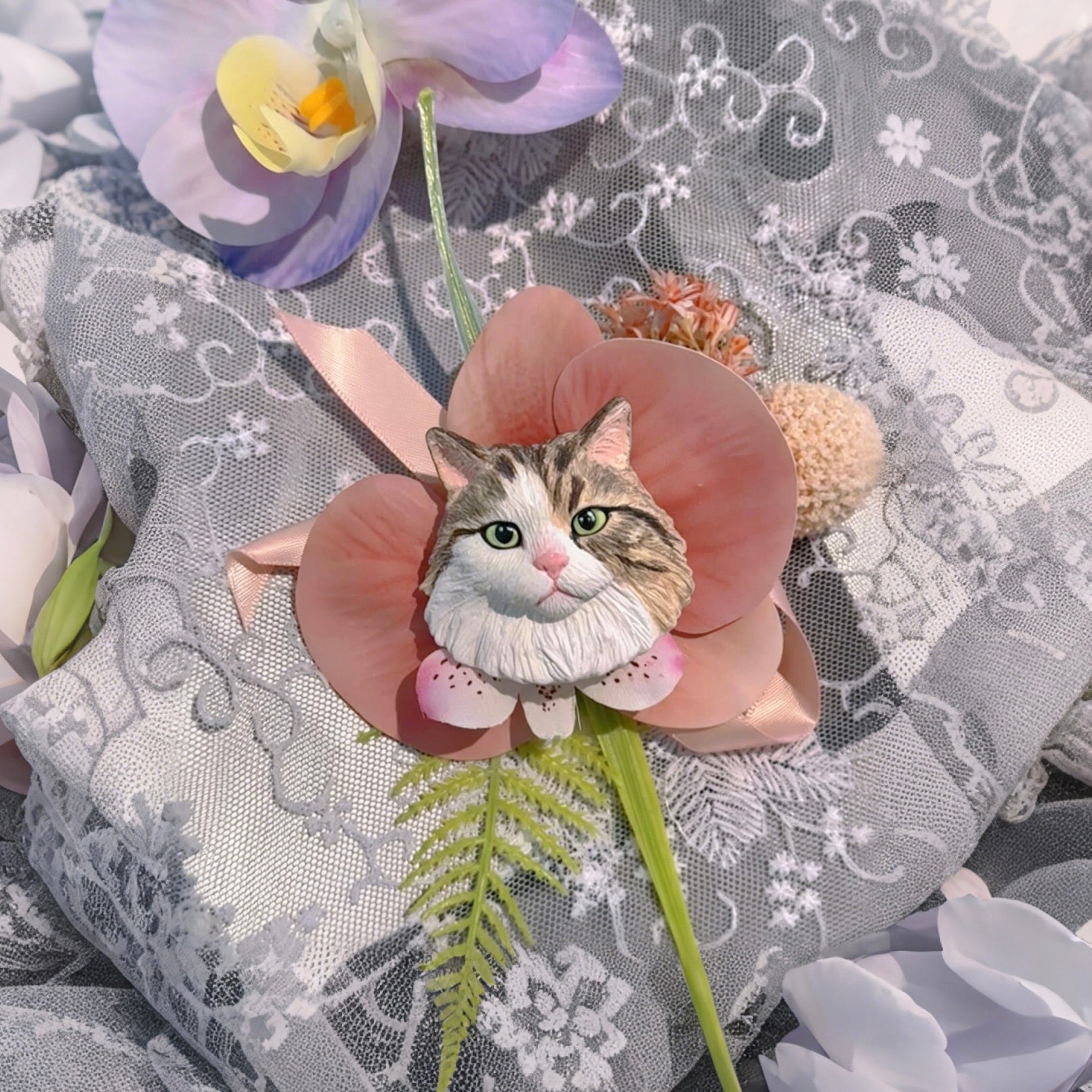 Hand-painted plaster tabby and white cat wedding boutonniere lapel pin with lotus pink artificial petals.