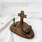 Wooden cross and heart-shaped object with measurements on a white fabric background