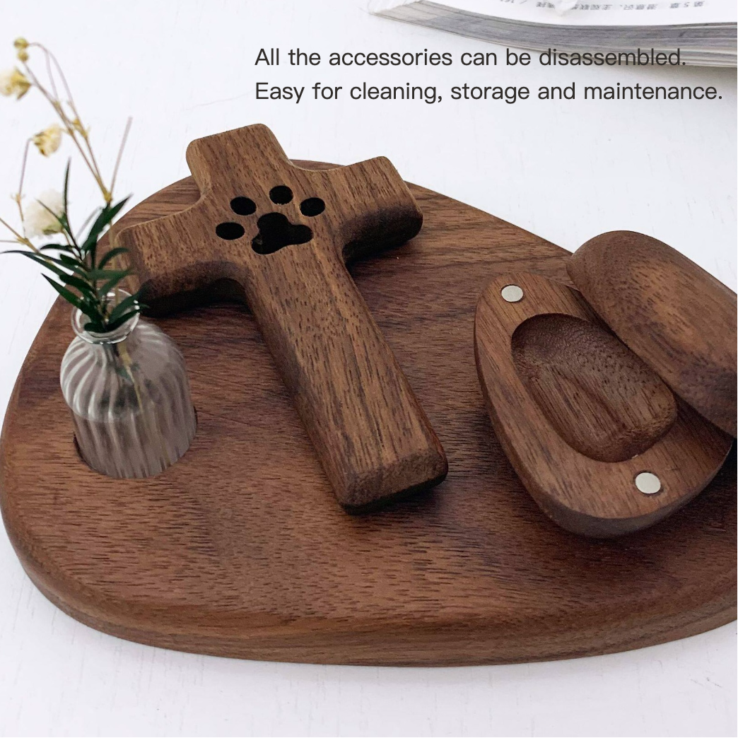 Wooden pet accessory set on a wooden tray with a small vase of flowers.
