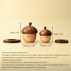 Three wooden acorn-shaped boxes with measurements and text on a beige background