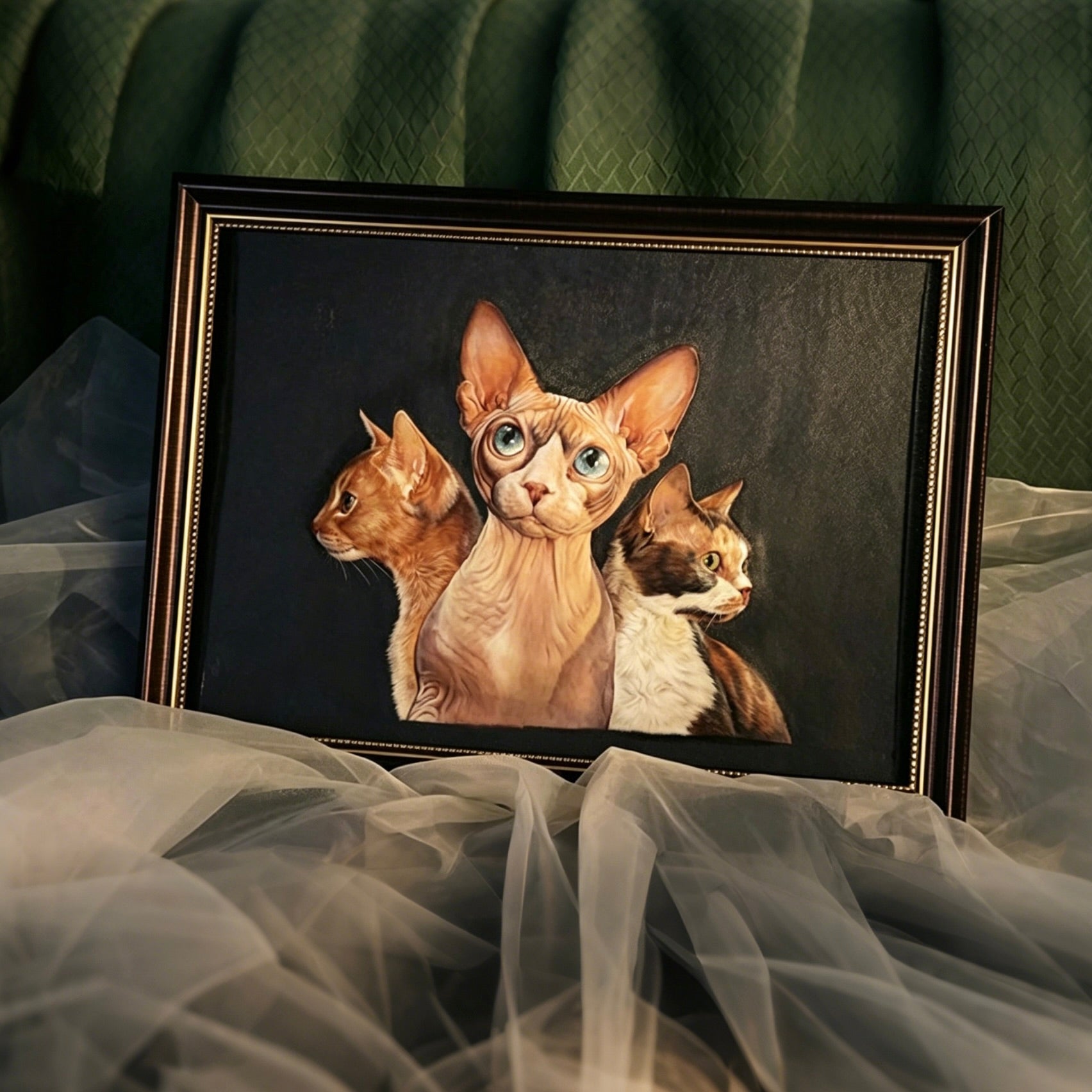 Framed artwork of three cats on a dark background with a green textured wall in the background.