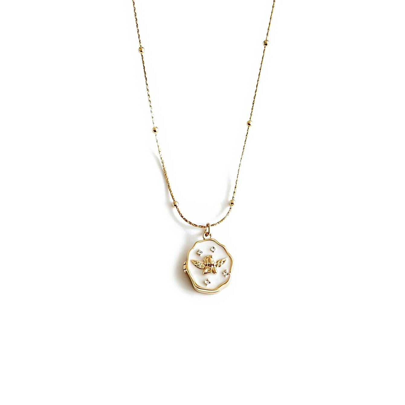 Gold necklace with a pendant on a white background