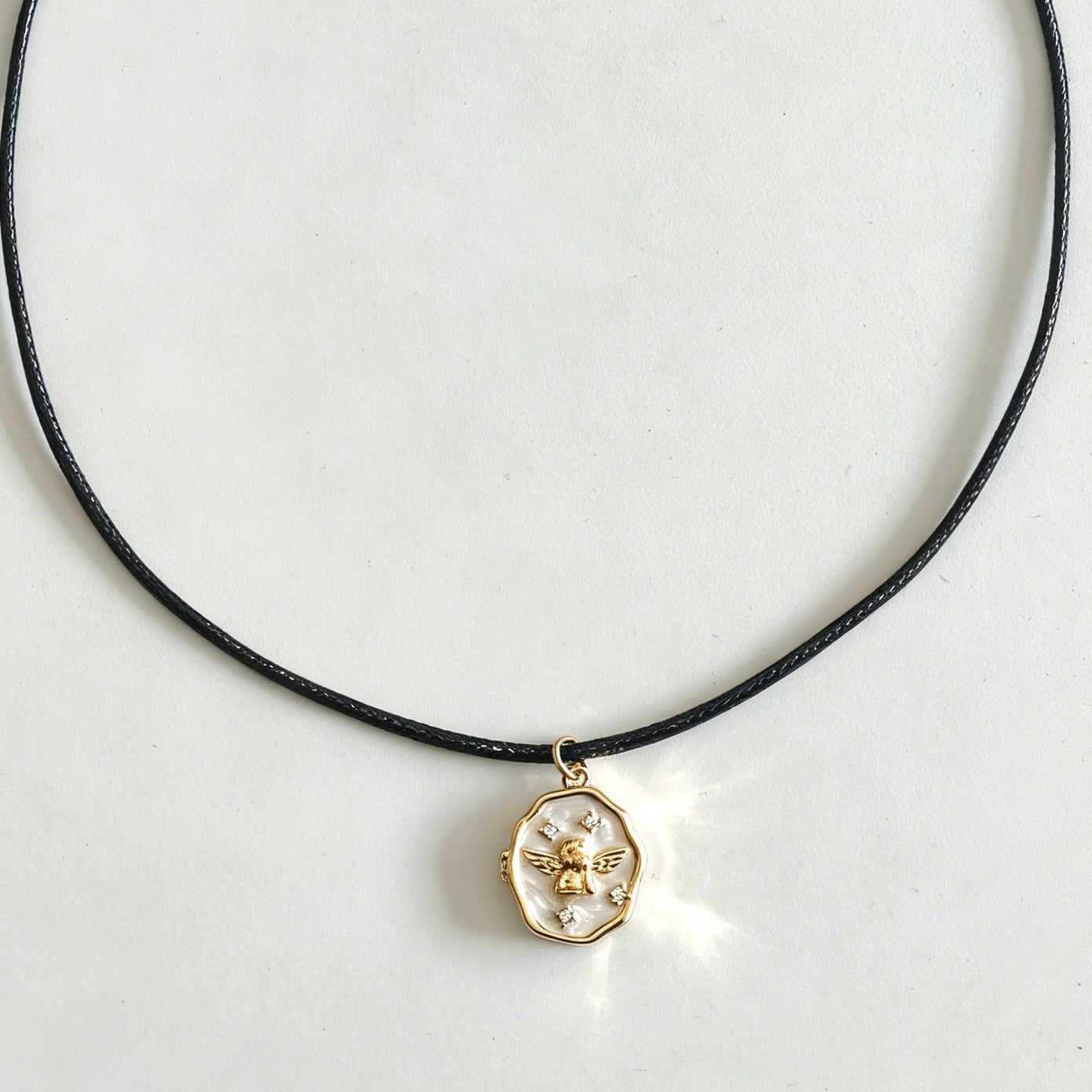 Necklace with a gold pendant on a white background