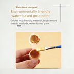 Water-based gold paint with a brush and container on a light gray background