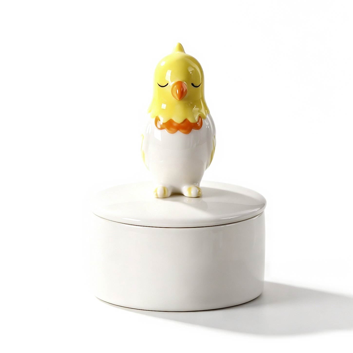 Ceramic chicken-shaped container on a white background