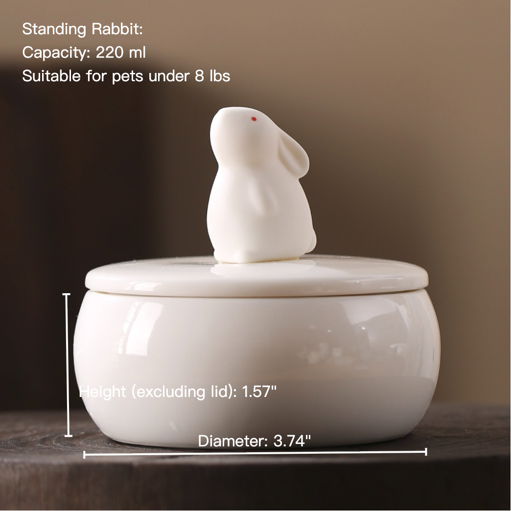 White ceramic rabbit-shaped container with measurements and capacity details on a dark background