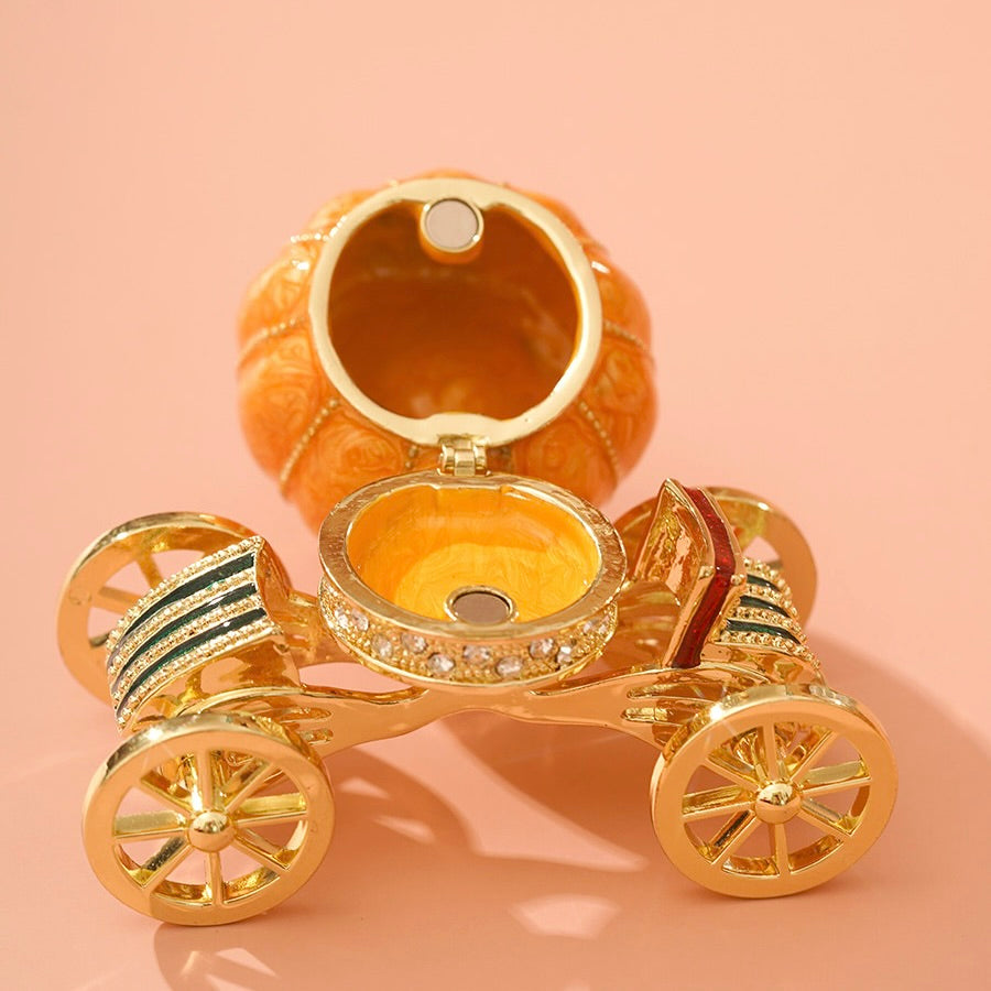 Gold car-shaped jewelry box on a peach background