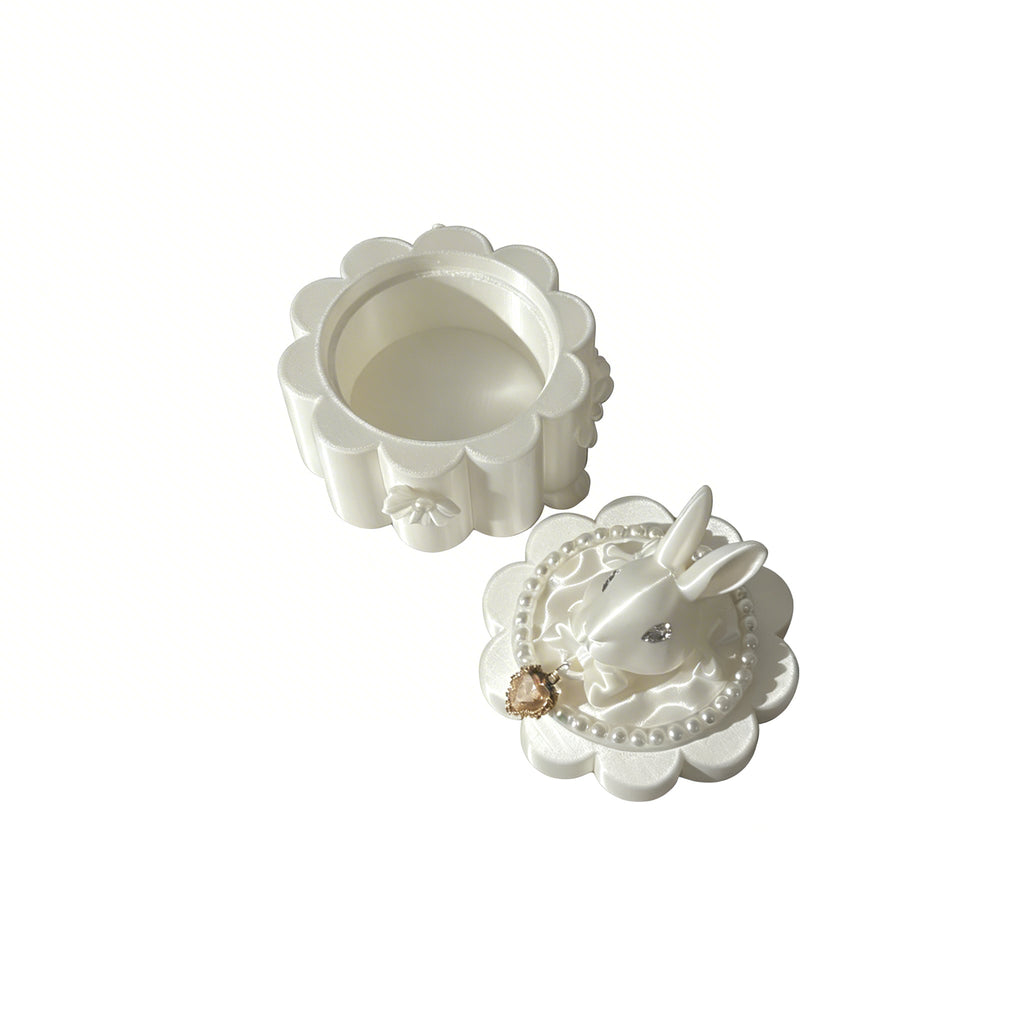 White decorative box with floral design on a white background