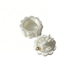 White decorative box with floral design on a white background