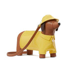Dog-shaped bag with a yellow raincoat and hat on a white background