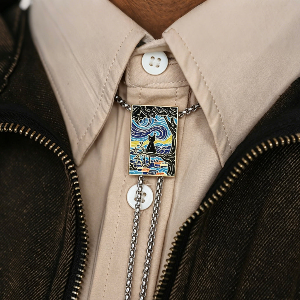 Black cat pendant on a chain attached to a jacket button
