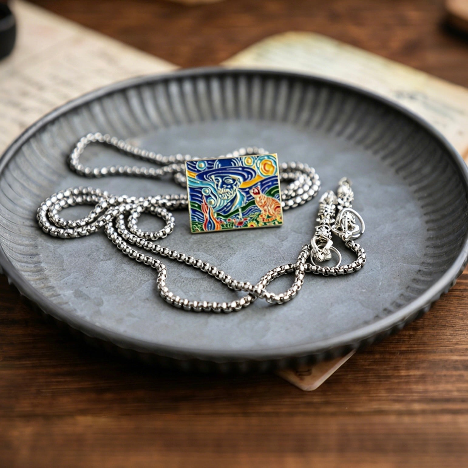 Necklace with a colorful pendant on a gray plate