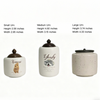Three urns with different sizes and labels on a white background