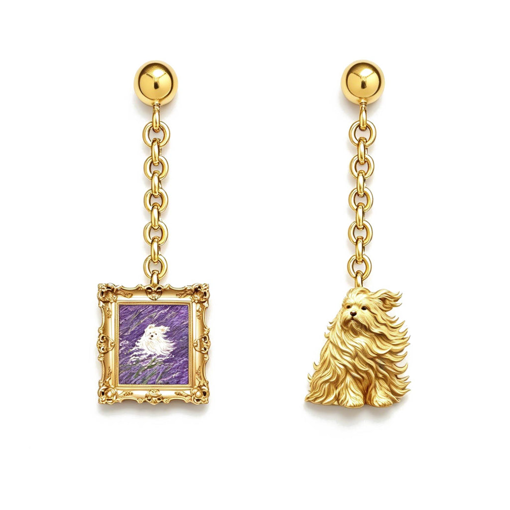 Gold earrings with a framed purple image and a dog charm on a white background