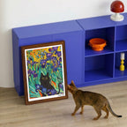 Cat scratching a wall-mounted sisal scratcher