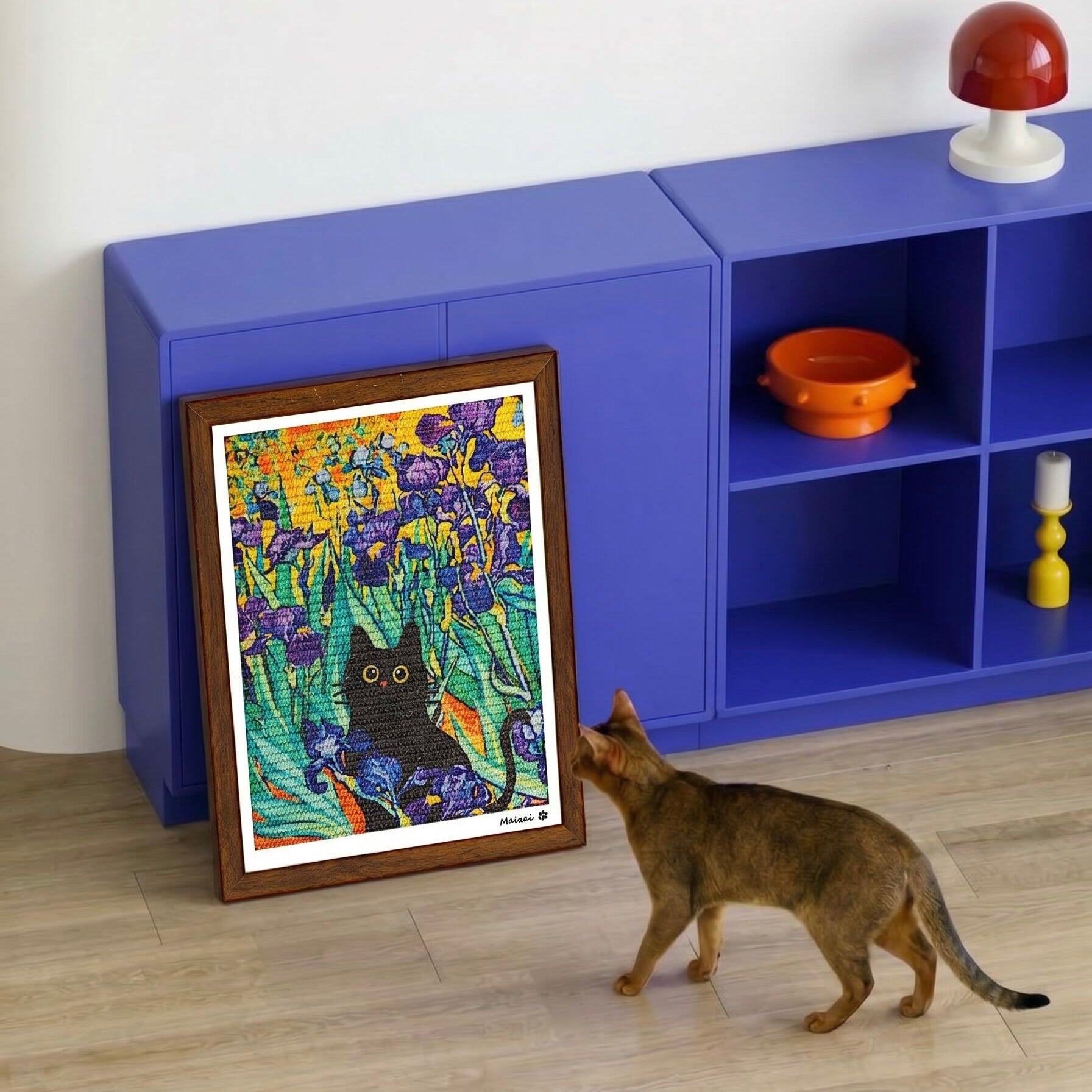 Cat scratching a wall-mounted sisal scratcher