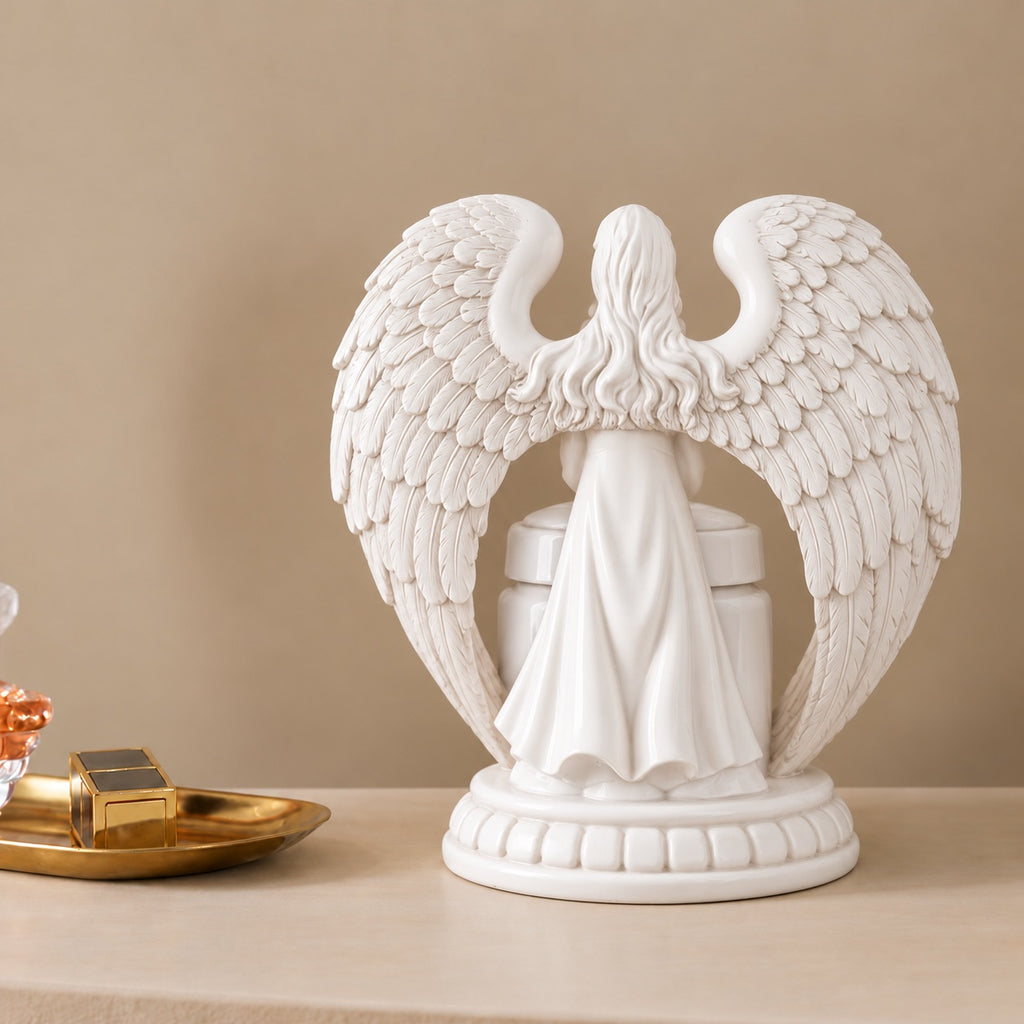 Back view of the white resin angel wing holder surrounding the ceramic pet memorial urn