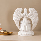 Back view of the white resin angel wing holder surrounding the ceramic pet memorial urn