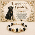 Black Labrador portrait bracelet with black and white beads beneath floral breed artwork