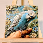 Unframed relief artwork of a blue-and-white budgie perched on a finger, surrounded by flowers and clouds