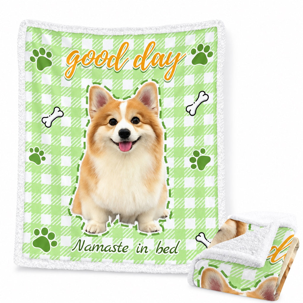 Green gingham sherpa blanket with a corgi portrait, paw prints and the words good day
