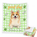 Green gingham sherpa blanket with a corgi portrait, paw prints and the words good day