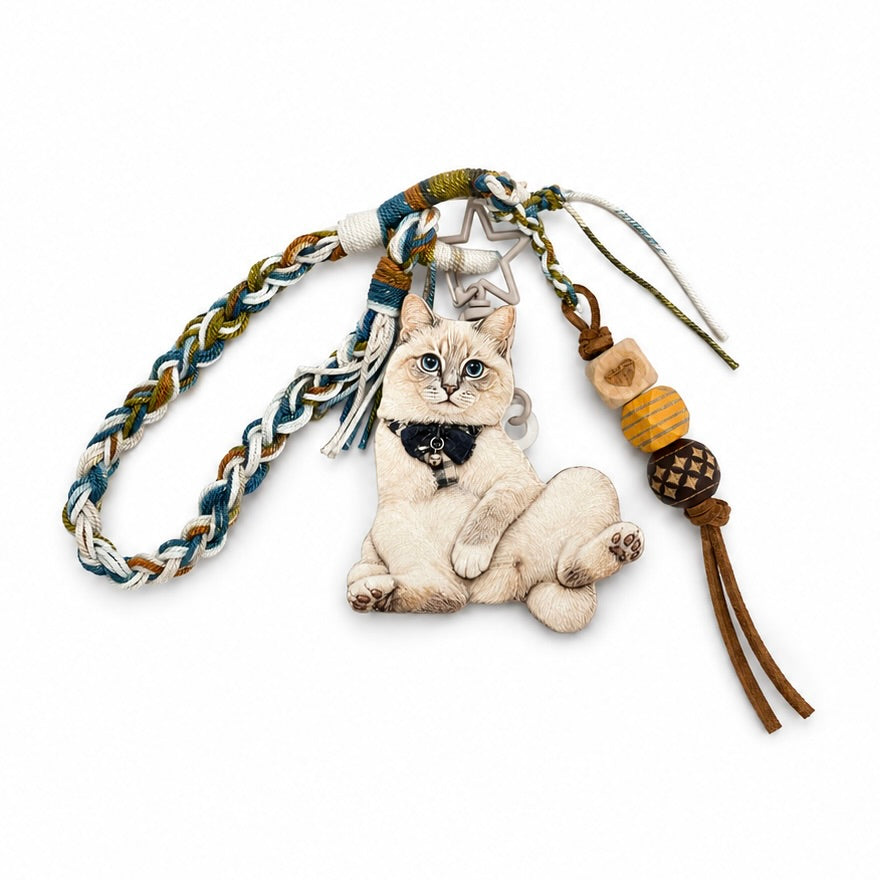 A collection of custom 3D pet relief keychains and bag charms with personalized hand-painted animal portraits on a textured surface.