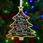 Custom family names acrylic Christmas tree ornament with pet paw symbols hanging among colorful lights