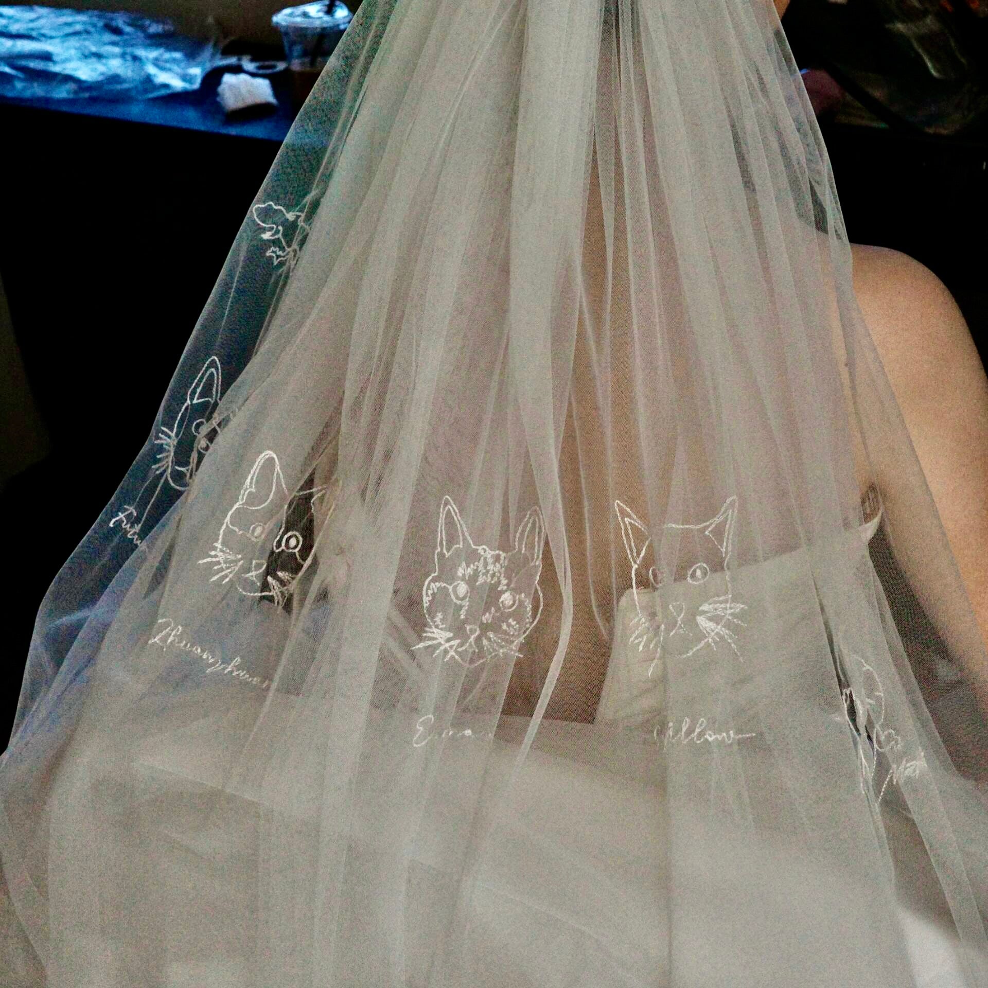 Close-up of a hand embroidered wedding veil from pet photo showing delicate artisan threads