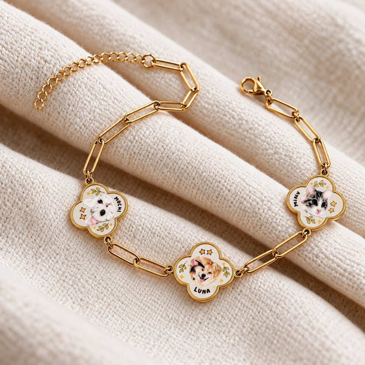 Gold-tone custom mother-of-pearl clover pet portrait bracelet featuring three pet photo charms with names MOCHI, LUNA, and MINI
