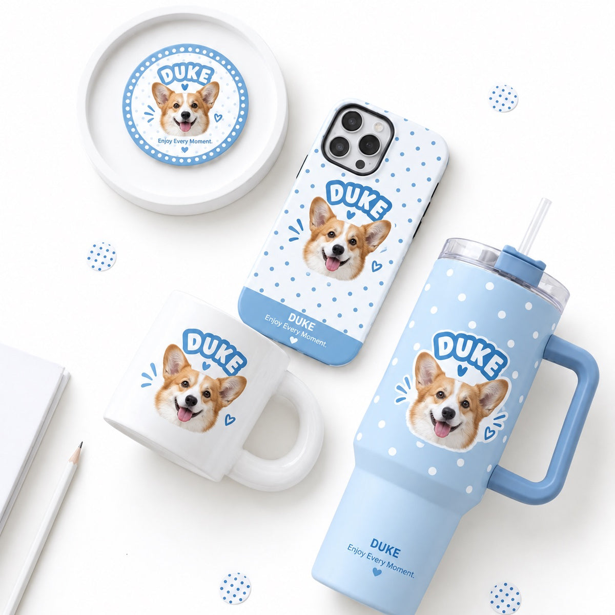 Personalized pet photo gift box set in blue checkered pattern including custom dog portrait mug, travel tumbler, phone case, and badge.