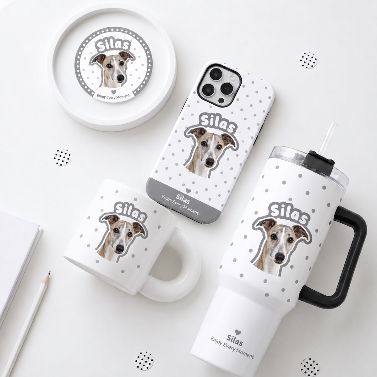 Personalized pet photo gift box set in grey polka dot pattern with custom pet portrait coffee mug, travel tumbler, phone case, and pin badge.