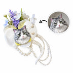 Custom plaster cat head wedding boutonniere for groom paired with a matching white floral wrist corsage for bride.