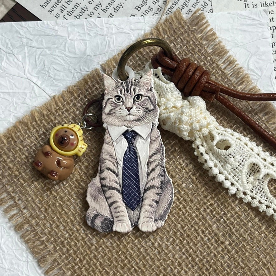 A personalized 3D pet photo keychain showcasing a touchable hand-painted cat charm.