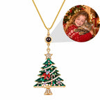 Custom photo projection Christmas tree necklace showing a personalized family and cat image inside the lens