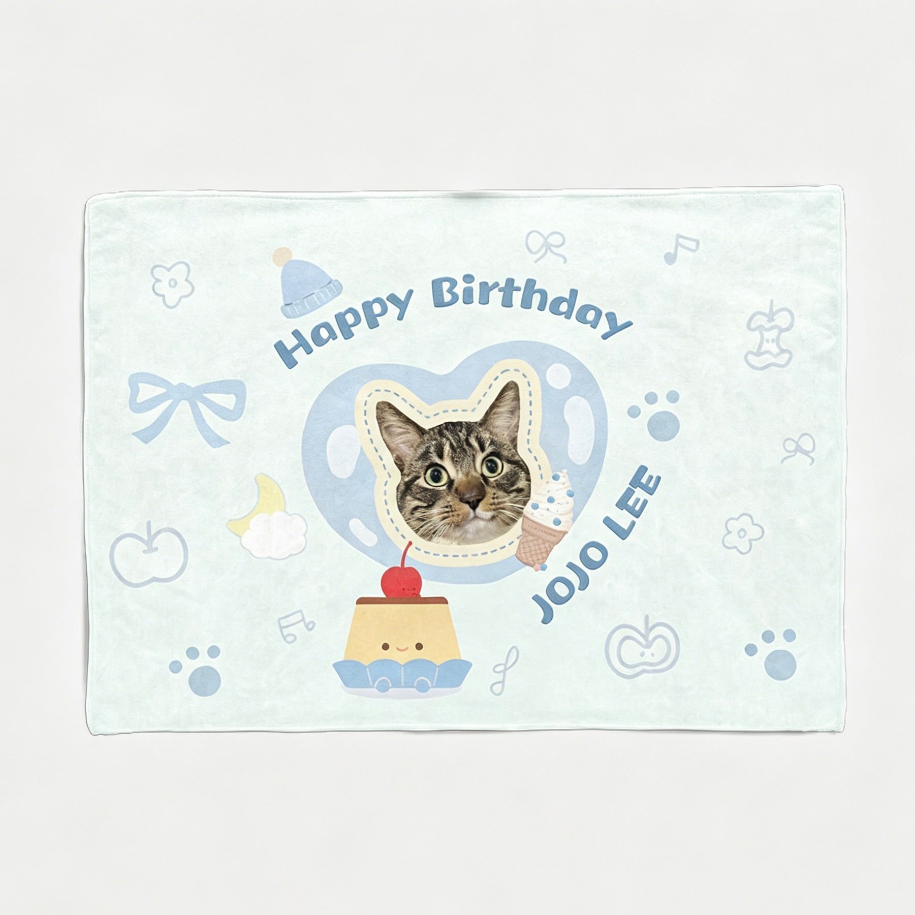 A light blue custom cat portrait birthday backdrop tapestry featuring a cute tabby cat wearing a party hat inside a heart frame, with the text Happy Birthday JOJO LEE.