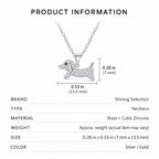Dachshund necklace size guide showing a brass and cubic zirconia pendant measuring 0.53 by 0.28 inches