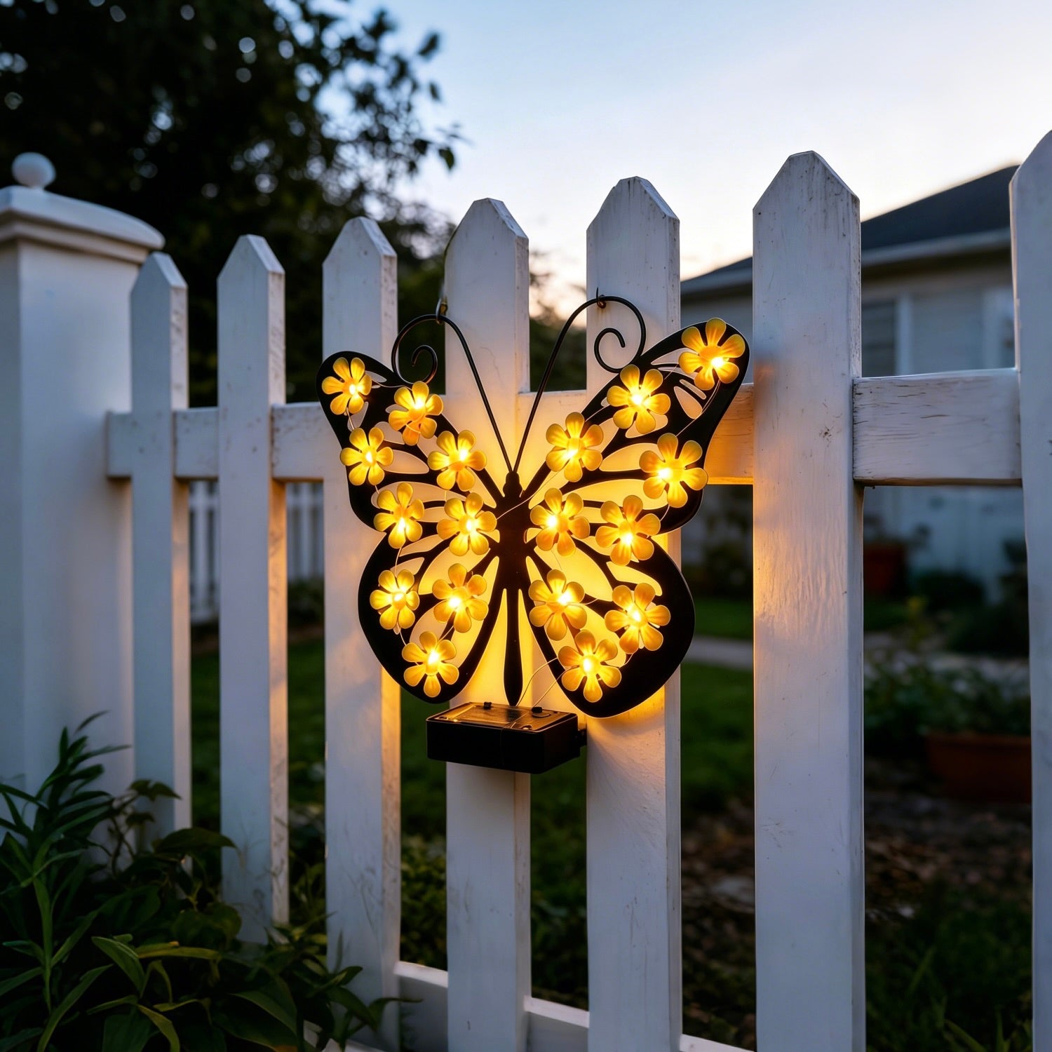 Cozy summer evening garden setup featuring the wireless decorative outdoor LED butterfly light illuminating a porch wall.