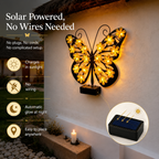 Video showing the automatic night glow and waterproof performance of the wireless solar butterfly garden light on an outdoor brick wall.