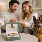 Couple presenting a German Shepherd portrait bracelet beside their dog and display box