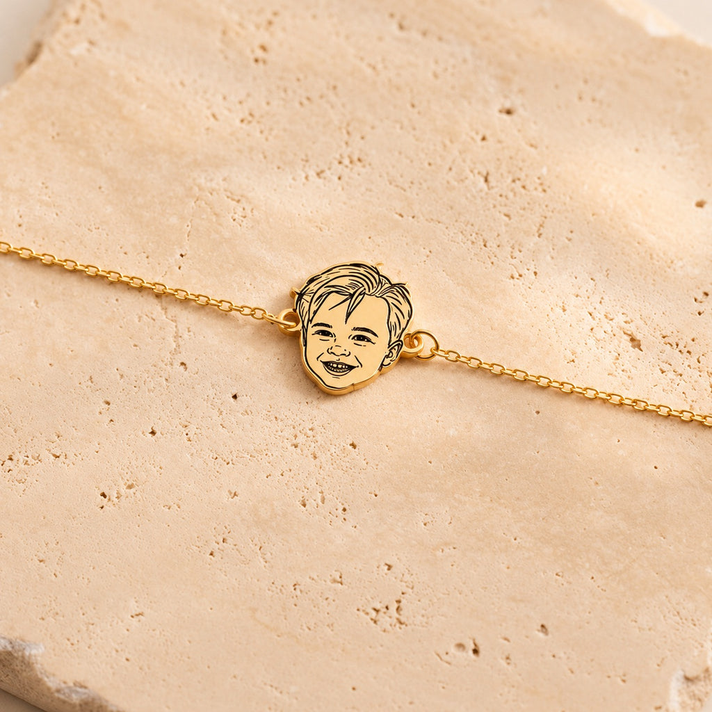 Gold-tone personalized bracelet with a custom child portrait line-art charm