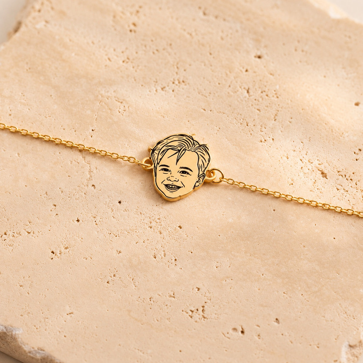 Gold-tone personalized bracelet with a custom child portrait line-art charm