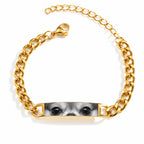 Gold-tone chain bracelet personalized with a close-up engraved portrait of a dog’s eyes