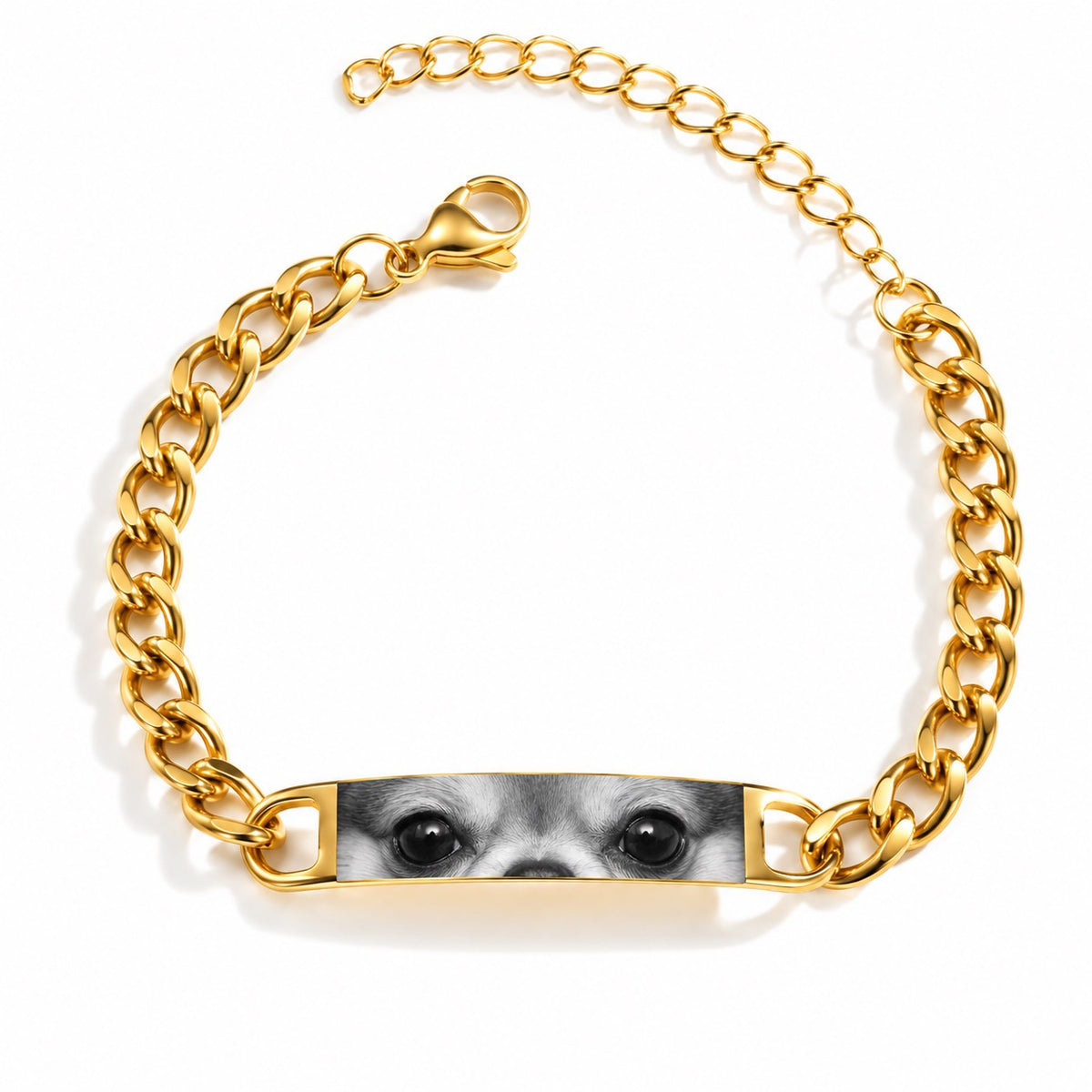 Gold-tone chain bracelet personalized with a close-up engraved portrait of a dog’s eyes
